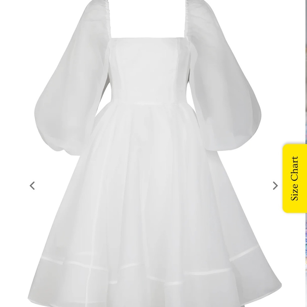 Selkie White Puff Sleeve Wedding Dress
New With Tags
